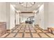 Inviting foyer with tiled floors, a chandelier, and an open view into the adjacent rooms at 743 N Orleans St, Henderson, NV 89015