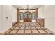 Elegant foyer featuring custom tile flooring, a decorative chandelier, and stylish entryway at 743 N Orleans St, Henderson, NV 89015