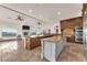 Open gourmet kitchen with double islands and modern appliances is ideal for entertaining at 743 N Orleans St, Henderson, NV 89015