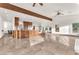 Bright living room features tile floors, wood beam ceilings, and recessed lighting at 743 N Orleans St, Henderson, NV 89015
