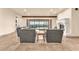 Comfortable living room with a fireplace, tiled flooring, and sliding doors to the outdoor patio at 743 N Orleans St, Henderson, NV 89015