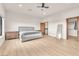 Main bedroom features wood floors, ceiling fan, walk-in closet, and an en-suite bathroom at 743 N Orleans St, Henderson, NV 89015