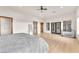 Spacious main bedroom featuring a ceiling fan, wood doorframes, wood floors, and abundant natural light at 743 N Orleans St, Henderson, NV 89015