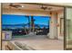 Outdoor patio with ceiling fans, turf, and stunning views of the Las Vegas skyline at 743 N Orleans St, Henderson, NV 89015