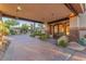 Beautiful home featuring a portico, double doors, and mature landscaping at 743 N Orleans St, Henderson, NV 89015