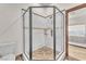 Glass enclosed shower with modern tile and bronze accents at 743 N Orleans St, Henderson, NV 89015