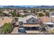 This aerial view shows the backyard with trampoline, covered patio, and neighborhood at 818 Grape Vine Ave, Henderson, NV 89002