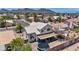 Aerial view of the home featuring a backyard with a trampoline, covered patio, and desert landscaping at 818 Grape Vine Ave, Henderson, NV 89002