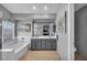 Bright bathroom featuring a double vanity, soaking tub, and modern fixtures at 818 Grape Vine Ave, Henderson, NV 89002
