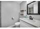 Bathroom featuring floating shelves and modern fixtures, along with neutral paint at 818 Grape Vine Ave, Henderson, NV 89002