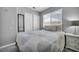 Comfortable bedroom with bed, side table, and a sliding door closet at 818 Grape Vine Ave, Henderson, NV 89002