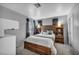 Bedroom featuring a wooden bed frame with built-in shelves and a window at 818 Grape Vine Ave, Henderson, NV 89002