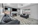 Comfortable living room boasts a fireplace, a large TV, and plush seating at 818 Grape Vine Ave, Henderson, NV 89002