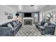 Inviting living room showcases a fireplace, large television, and plenty of seating at 818 Grape Vine Ave, Henderson, NV 89002