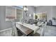 Bright dining and living area featuring stylish seating, modern light fixtures, and decor at 818 Grape Vine Ave, Henderson, NV 89002