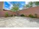 Large backyard featuring stone patio and outdoor seating at 8565 Silver Coast St, Las Vegas, NV 89139