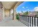 Spacious balcony with wrought iron railing offering neighborhood views of the surrounding community at 8565 Silver Coast St, Las Vegas, NV 89139