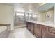 Luxurious bathroom with double vanity, soaking tub and glass enclosed shower at 8565 Silver Coast St, Las Vegas, NV 89139