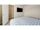 Bedroom with a wall mounted television and a small walk-in closet at 8565 Silver Coast St, Las Vegas, NV 89139