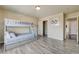 Bright bedroom features a bunk bed, closet, and light wood-look floors at 8565 Silver Coast St, Las Vegas, NV 89139