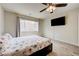 Charming bedroom featuring wood-look floors and a large television screen at 8565 Silver Coast St, Las Vegas, NV 89139