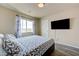 Bedroom with a window view and wall mounted television at 8565 Silver Coast St, Las Vegas, NV 89139