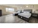 Bedroom featuring two beds, stylish furniture, and a window showcasing the exterior view at 8565 Silver Coast St, Las Vegas, NV 89139