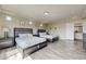 Spacious bedroom with two queen beds, modern furnishings, and plank flooring at 8565 Silver Coast St, Las Vegas, NV 89139