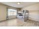 Spacious bedroom features a bunk bed, large window, and light wood-look flooring at 8565 Silver Coast St, Las Vegas, NV 89139