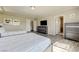Bright bedroom features two beds, neutral walls, and an entertainment center at 8565 Silver Coast St, Las Vegas, NV 89139