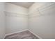 Walk-in closet featuring wood-look floors and extensive shelving at 8565 Silver Coast St, Las Vegas, NV 89139