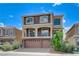 Lovely two-story home with stone accents, a balcony, and three-car garage at 8565 Silver Coast St, Las Vegas, NV 89139