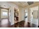 Hallway showing doorways leading to a bathroom and bedrooms featuring hard surface floors at 8565 Silver Coast St, Las Vegas, NV 89139