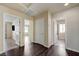 Hallway showcasing multiple doorways and laminate floors providing access to rooms at 8565 Silver Coast St, Las Vegas, NV 89139