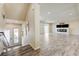 Open floor plan showcasing wood-look flooring and a modern fireplace at 8565 Silver Coast St, Las Vegas, NV 89139