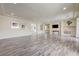 Large living room with wood-look floors, neutral walls, and recessed lighting at 8565 Silver Coast St, Las Vegas, NV 89139