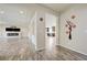 Spacious living room featuring wood-look flooring and a modern fireplace at 8565 Silver Coast St, Las Vegas, NV 89139