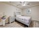 Comfortable main bedroom featuring a ceiling fan, wood floors, and coordinated nightstands at 8565 Silver Coast St, Las Vegas, NV 89139