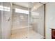 Spacious walk-in shower with tile surround and built-in bench at 8565 Silver Coast St, Las Vegas, NV 89139