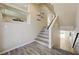 Open staircase design showcasing natural light and wood-look flooring at 8565 Silver Coast St, Las Vegas, NV 89139
