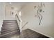 Staircase with hard surface steps and white banister, enhanced by decorative wall art at 8565 Silver Coast St, Las Vegas, NV 89139