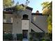 Two-story condo building exterior, unit 52 with dual entrances and desert landscaping at 9000 Las Vegas Blvd # 1142, Las Vegas, NV 89123