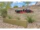 Beautiful community entrance sign with well-maintained landscaping and stone features at 9557 Belmont Bay Ave, Las Vegas, NV 89148