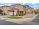 Stunning two-story home showcasing arched entryway, attached garage, and landscaped front yard at 9557 Belmont Bay Ave, Las Vegas, NV 89148