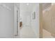 Bright hallway featuring tile floors, access to the bathroom, closet and entry way at 9557 Belmont Bay Ave, Las Vegas, NV 89148