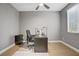 Well-lit office featuring modern decor, hard wood floors, and a large window at 9557 Belmont Bay Ave, Las Vegas, NV 89148