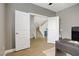 Bright office space with neutral walls, wood floors, and staircase view through double doors at 9557 Belmont Bay Ave, Las Vegas, NV 89148