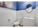 Stylish powder room with custom paint, vanity, and modern fixtures at 9557 Belmont Bay Ave, Las Vegas, NV 89148