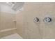 Modern shower featuring stylish tilework, seating and sleek fixtures at 9557 Belmont Bay Ave, Las Vegas, NV 89148
