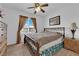 Cozy bedroom with a comfortable bed, natural light, and dresser at 9614 Stonily Ln, Las Vegas, NV 89178